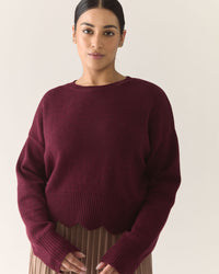 Woman wearing a burgundy sweater 