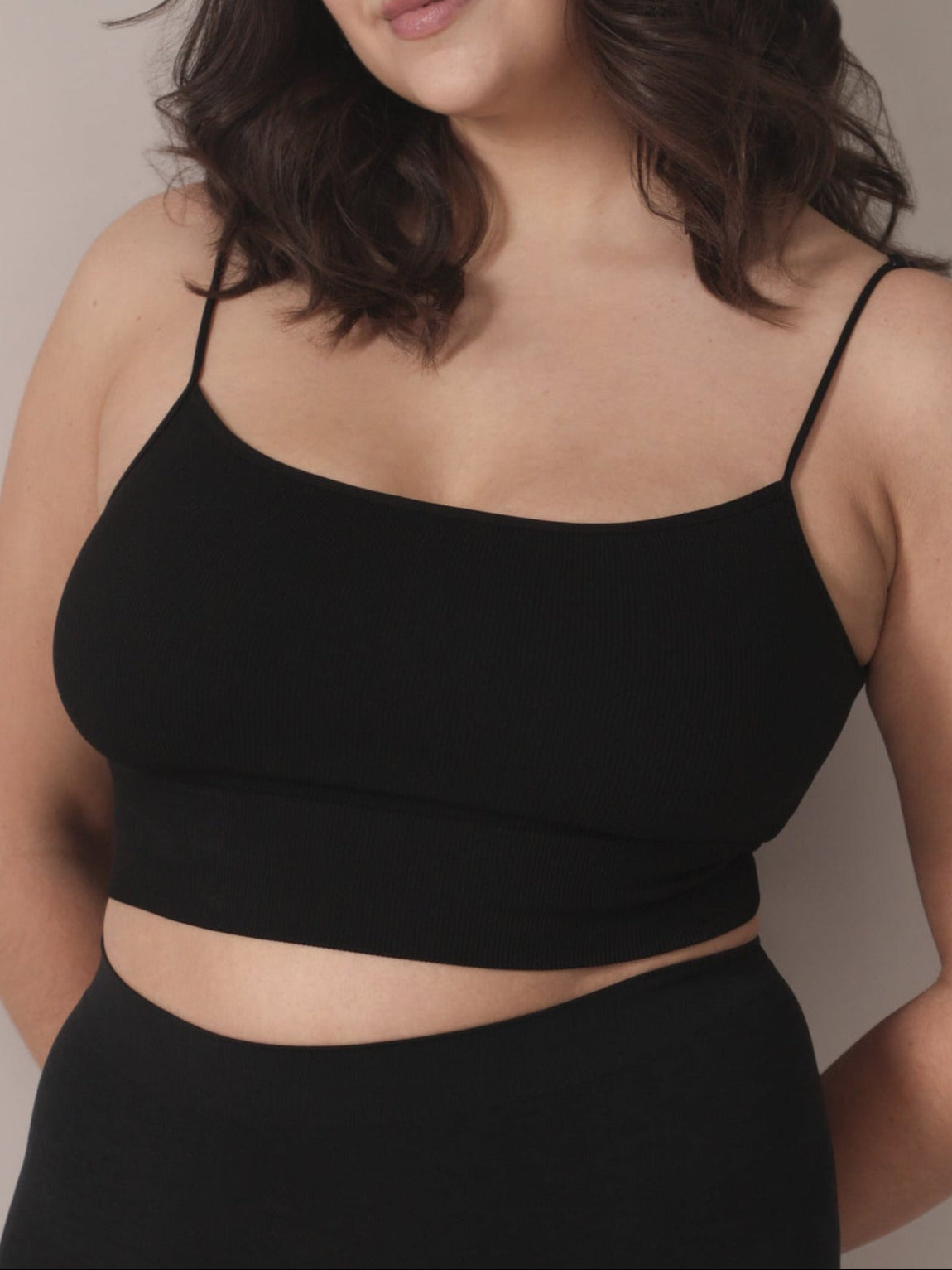 Woman wearing a black bralette